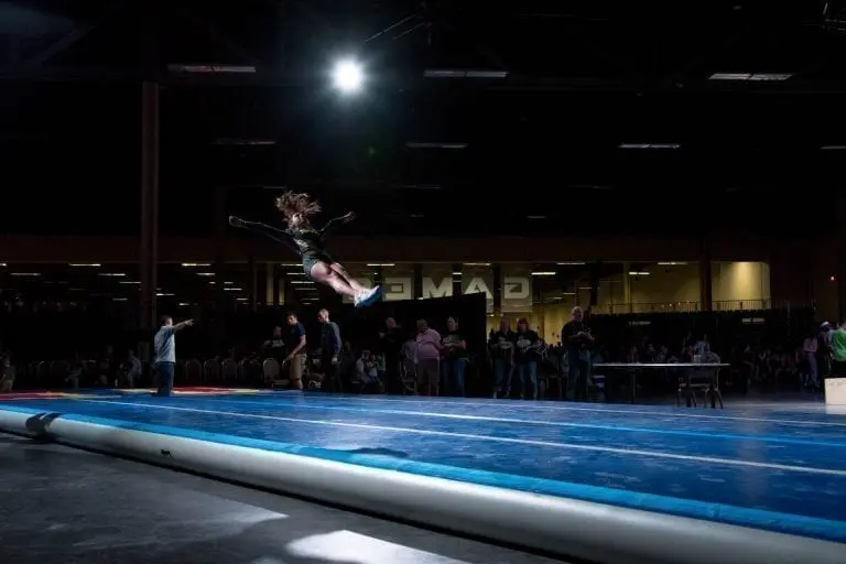 cheerleader jumping high at all star games on airtrack p3