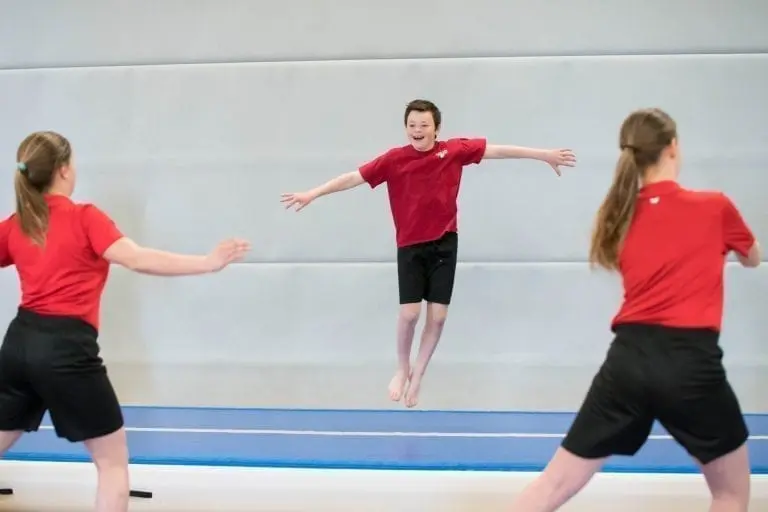 boy at school jumping on airtrack p3