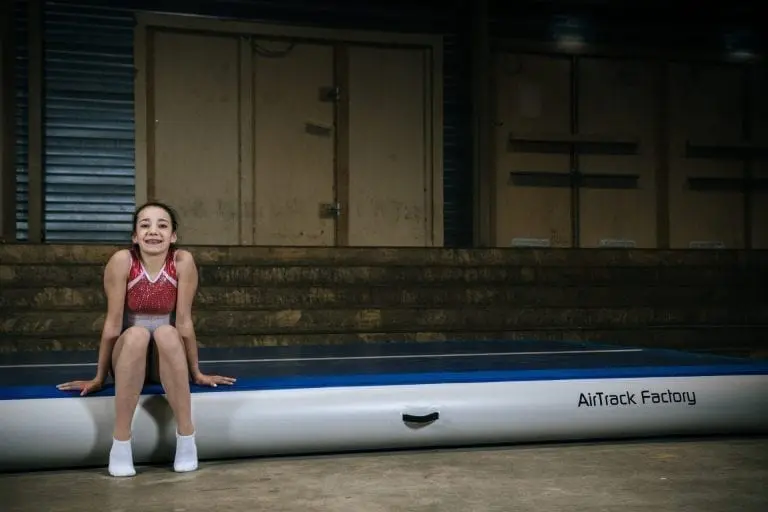 gymnast sitting on airtrack p3