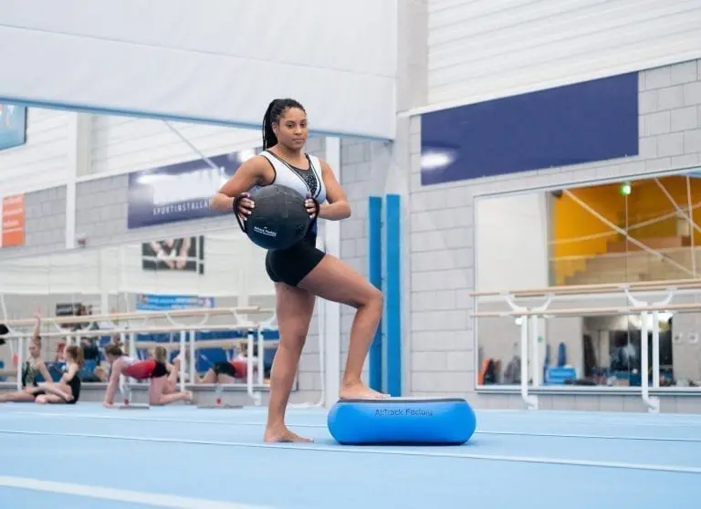 Gymnast with aquabag on airblock