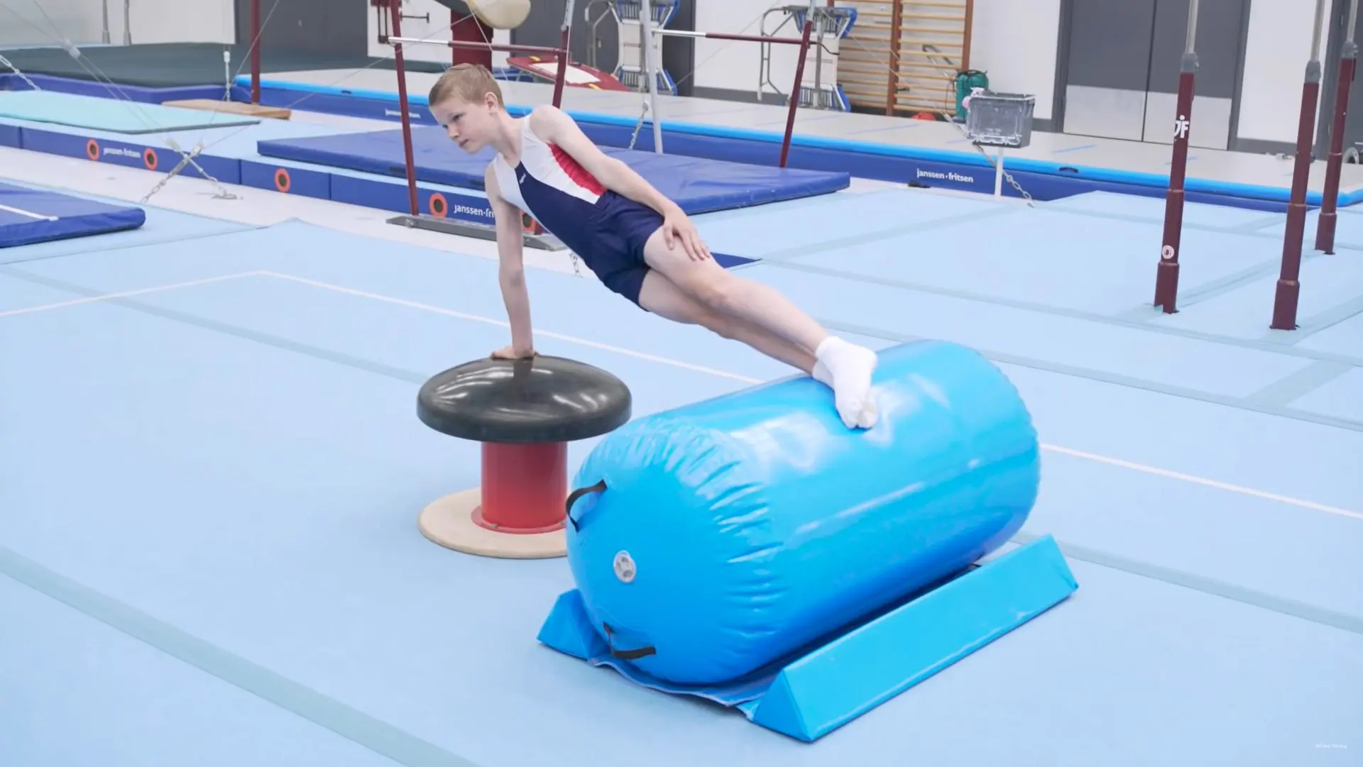 Boy gymnast with blue AirRoll