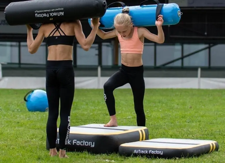 Gymnasts exercising on AirBlock with AquaBags
